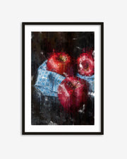 Framed artwork of three red apples on a dark background