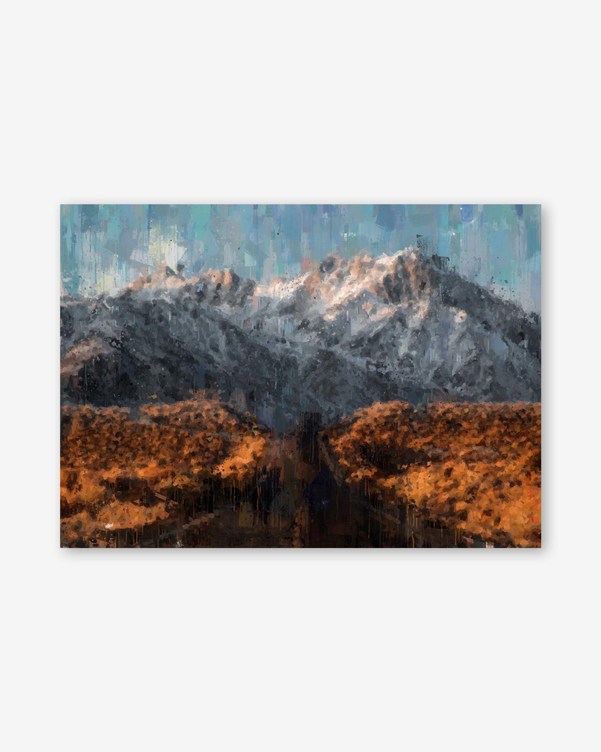 Mountain landscape with snow-capped peaks and orange-brown foreground