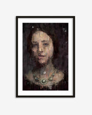 Framed artwork of a woman's portrait with a dark background