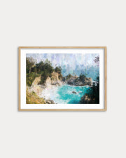 Framed artwork of a coastal scene with turquoise water and greenery on a white wall.