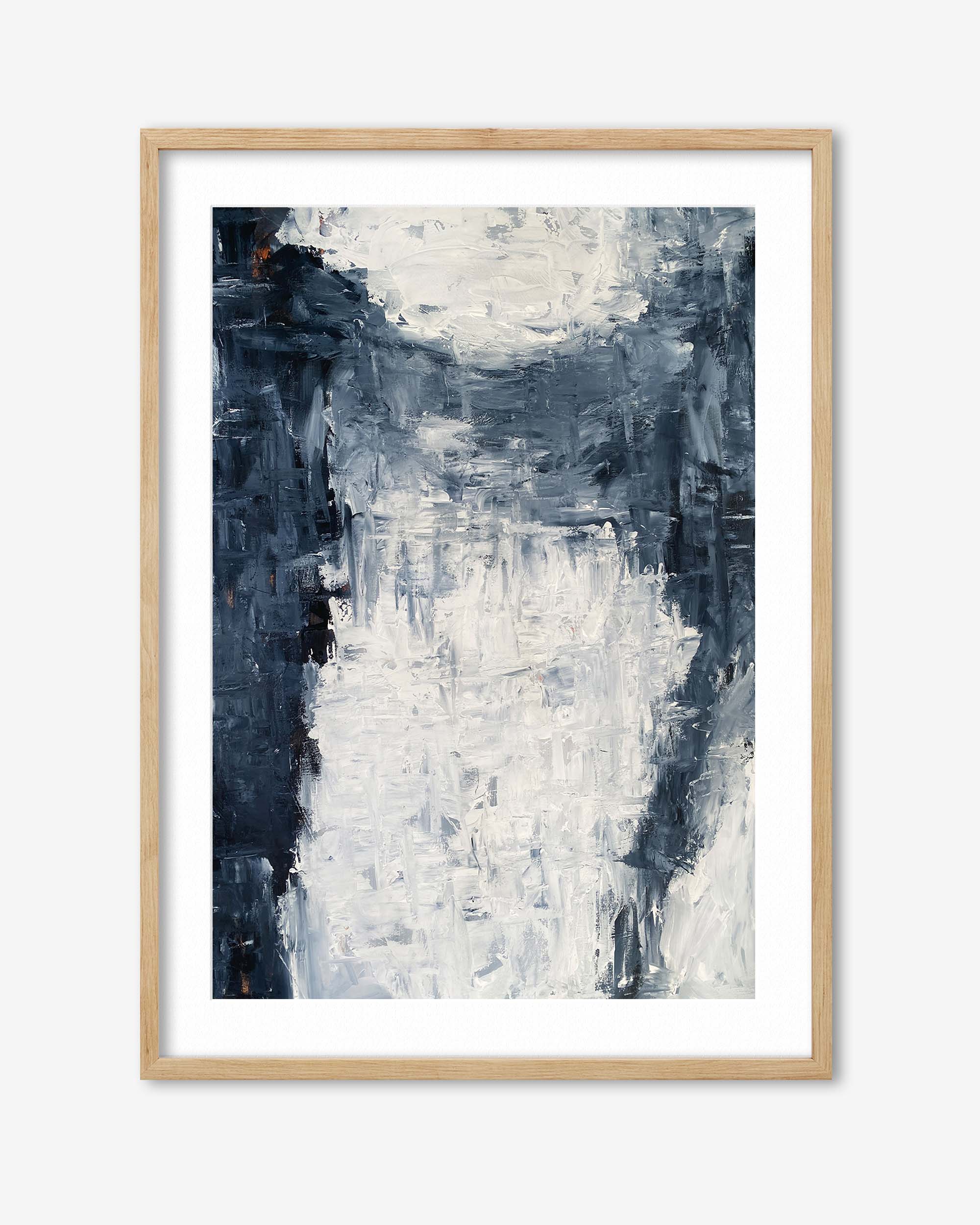 Abstract art print in a wooden frame on a white background