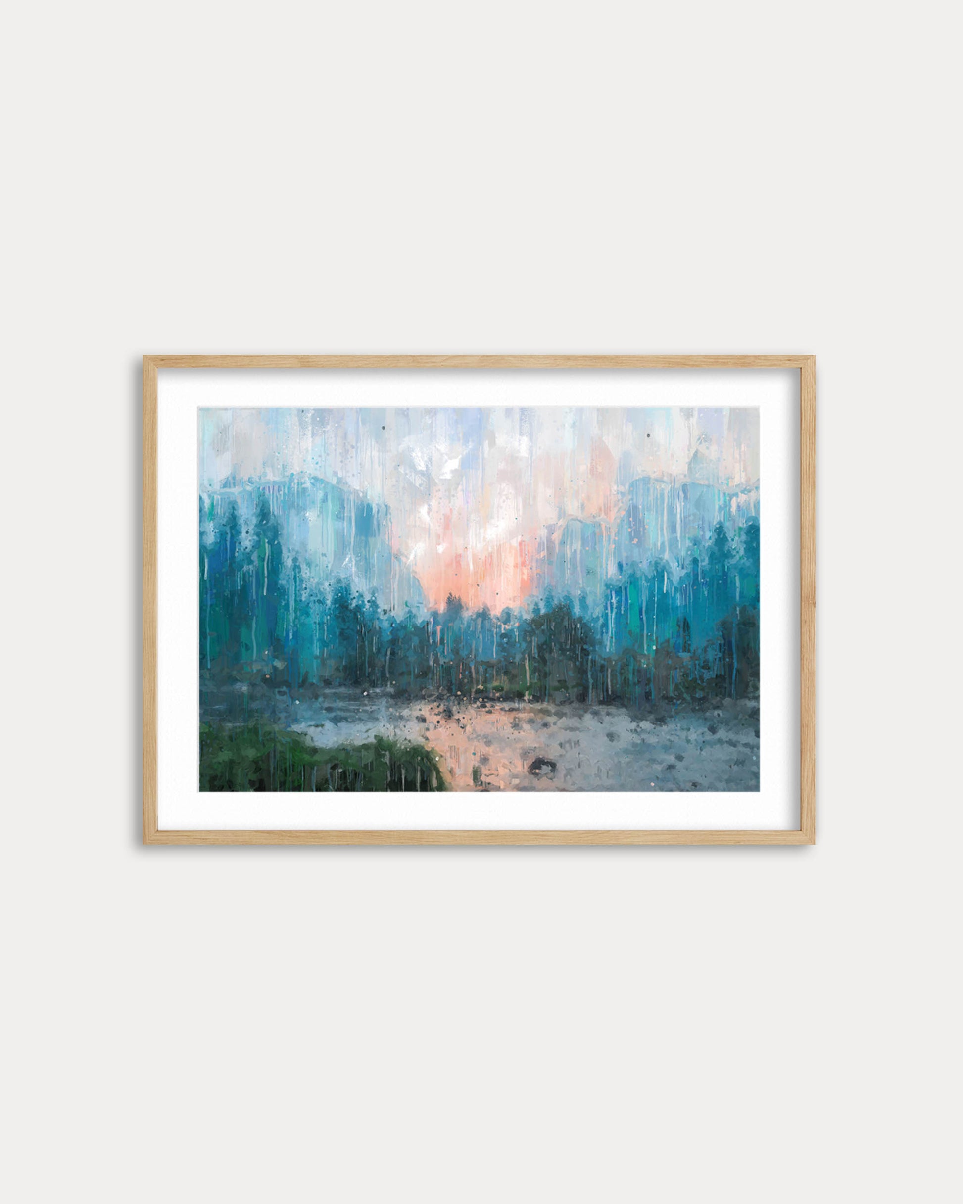 Framed abstract landscape painting on a white wall