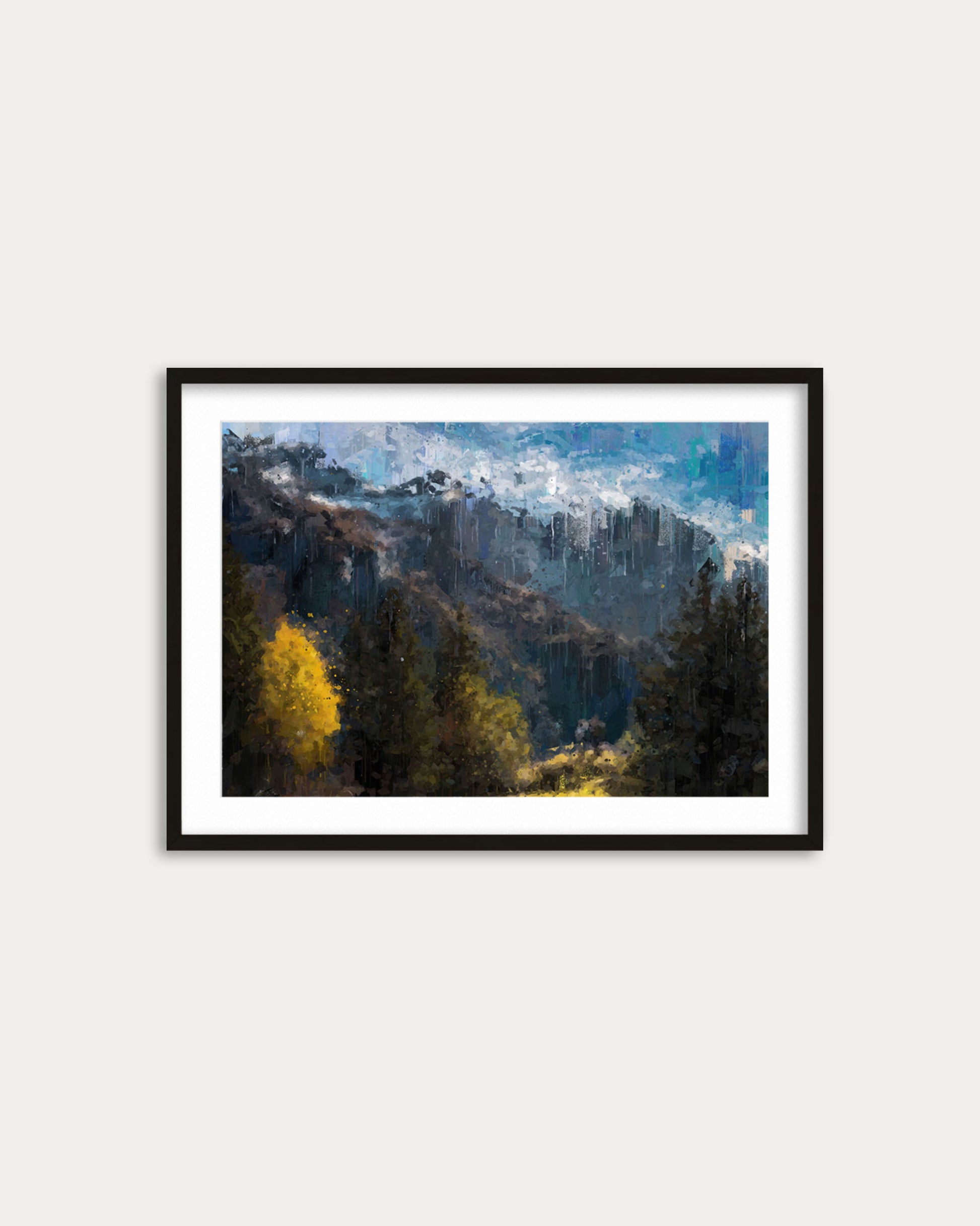 Framed artwork of a mountain landscape with trees on a white wall