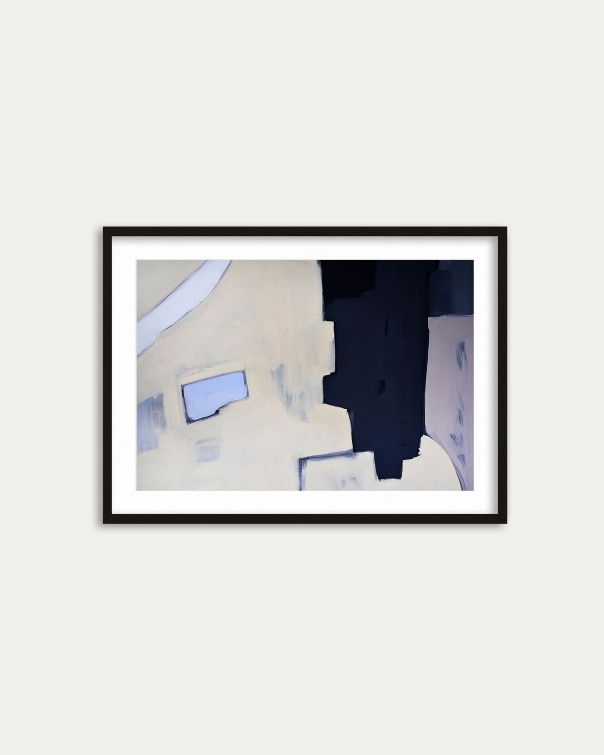 Framed abstract art piece on a white wall