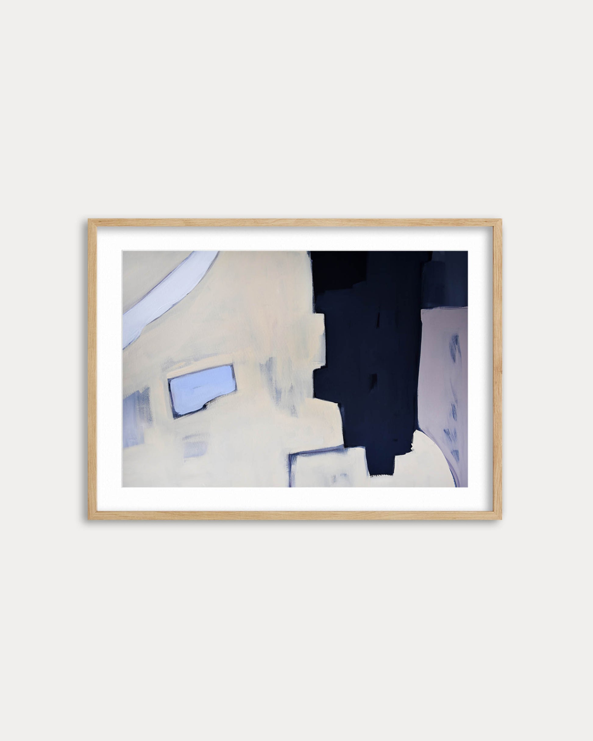 Framed abstract art piece on a white wall