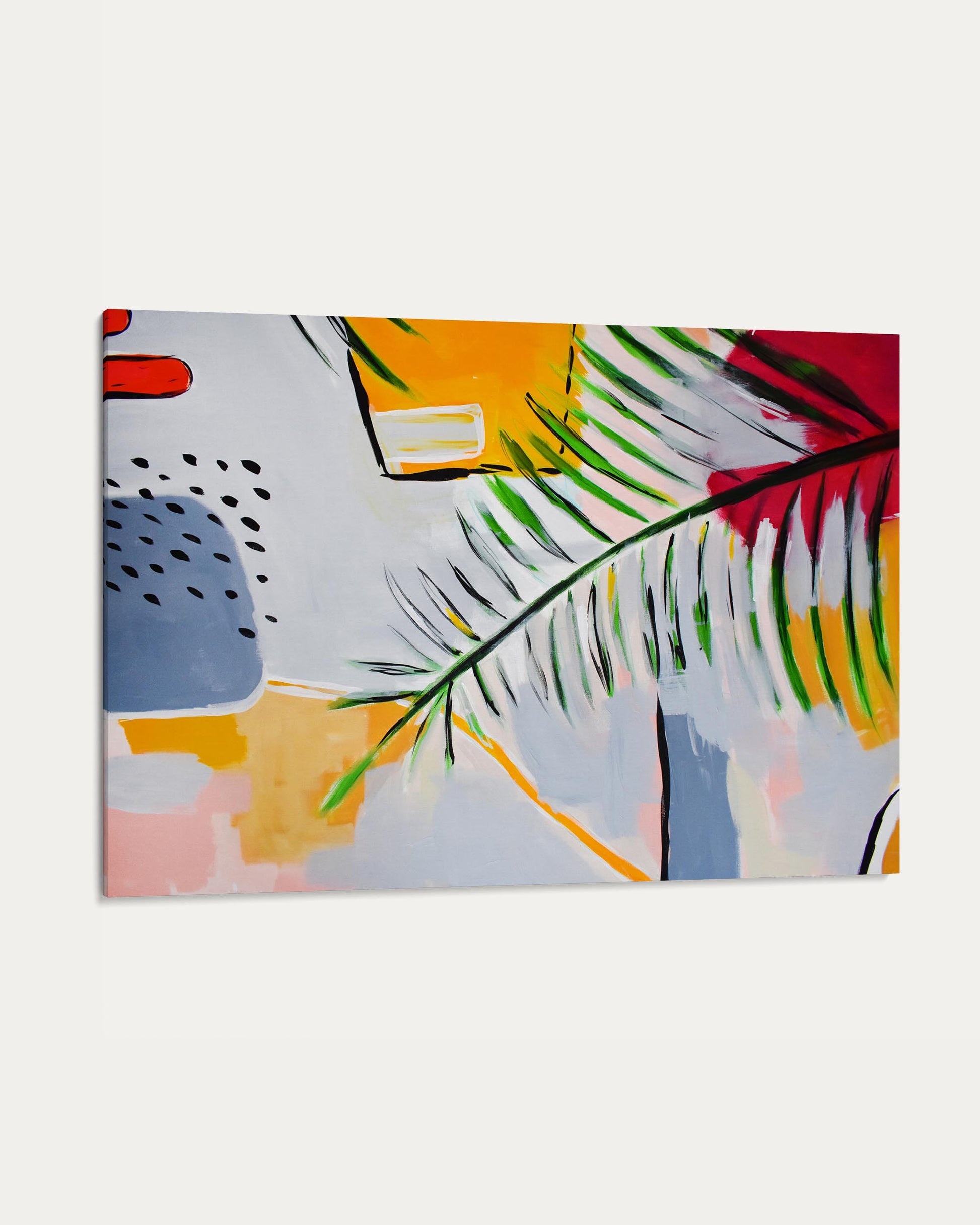 Abstract art piece with colorful shapes and a leaf on a white background