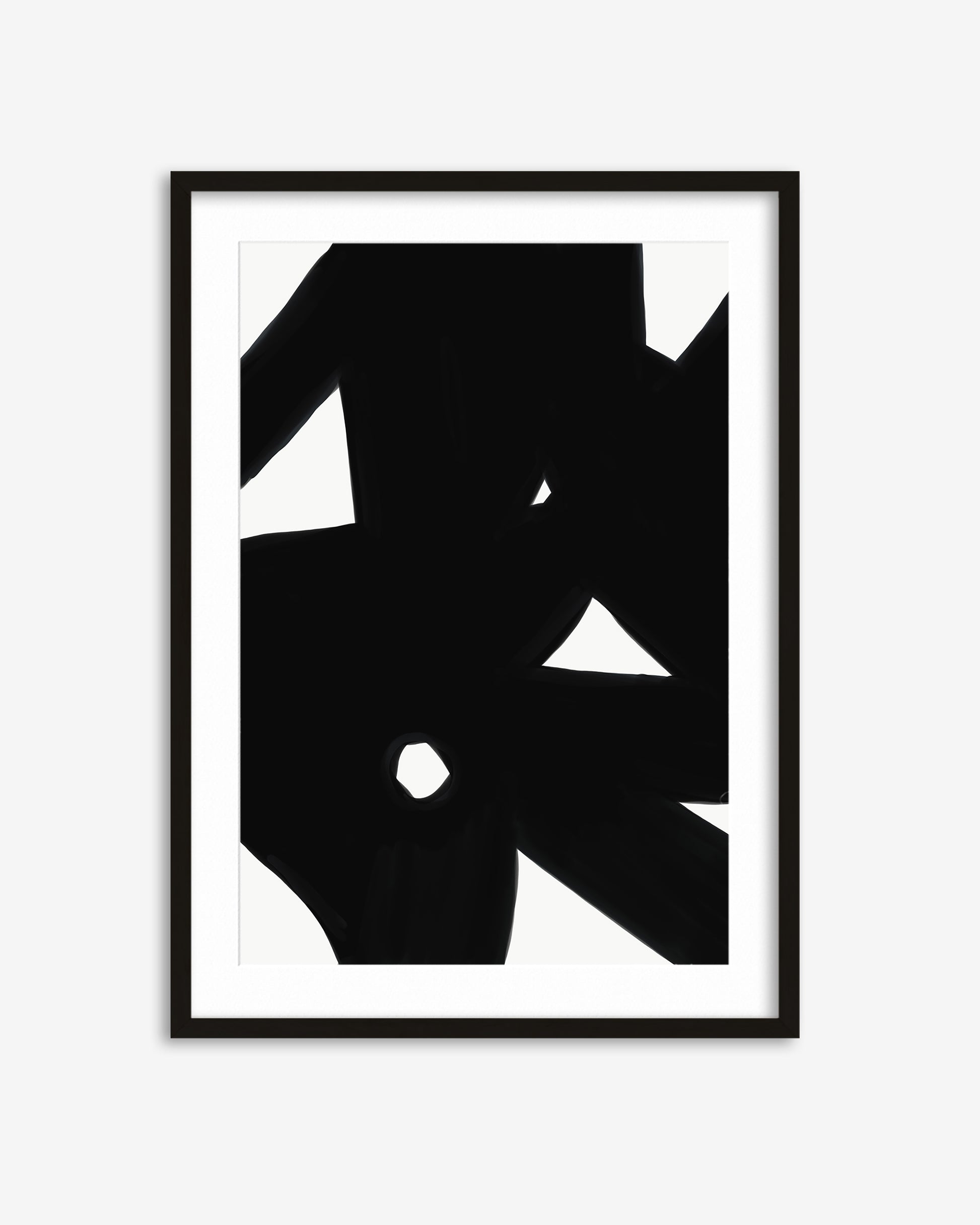 Black abstract art print in a black frame on a white background