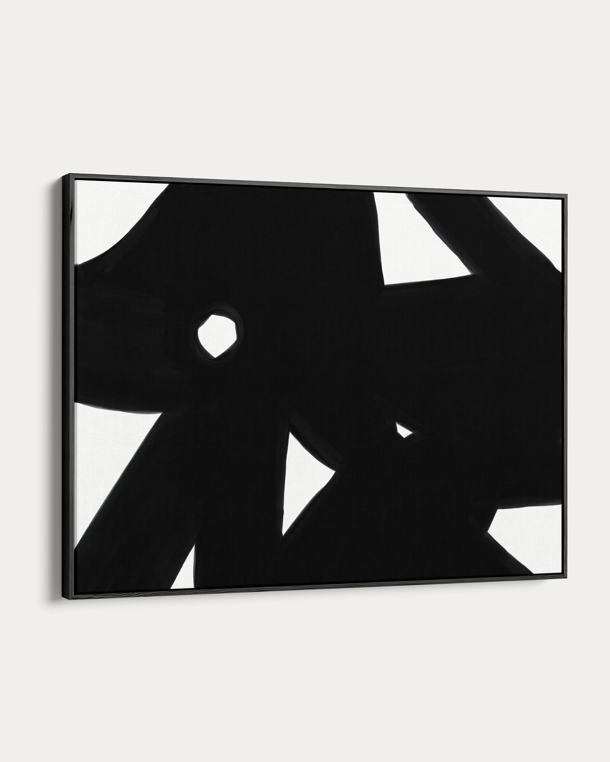 Abstract black and white artwork on a white wall