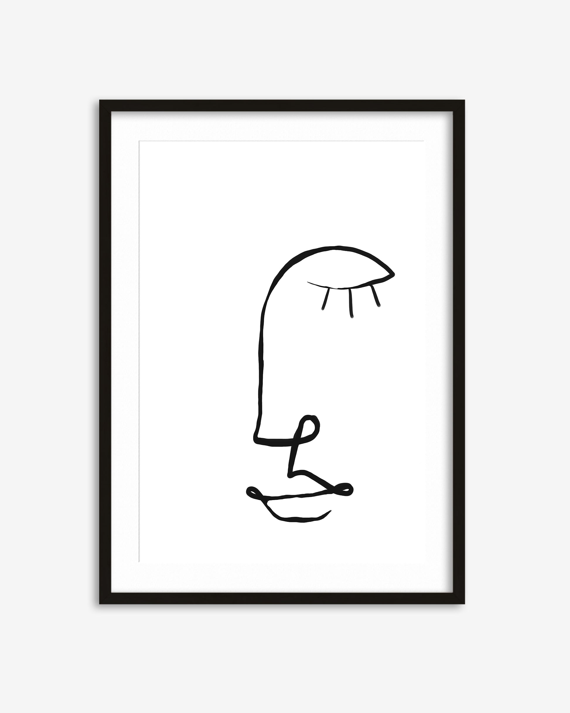 Framed black line art of a face on a white background