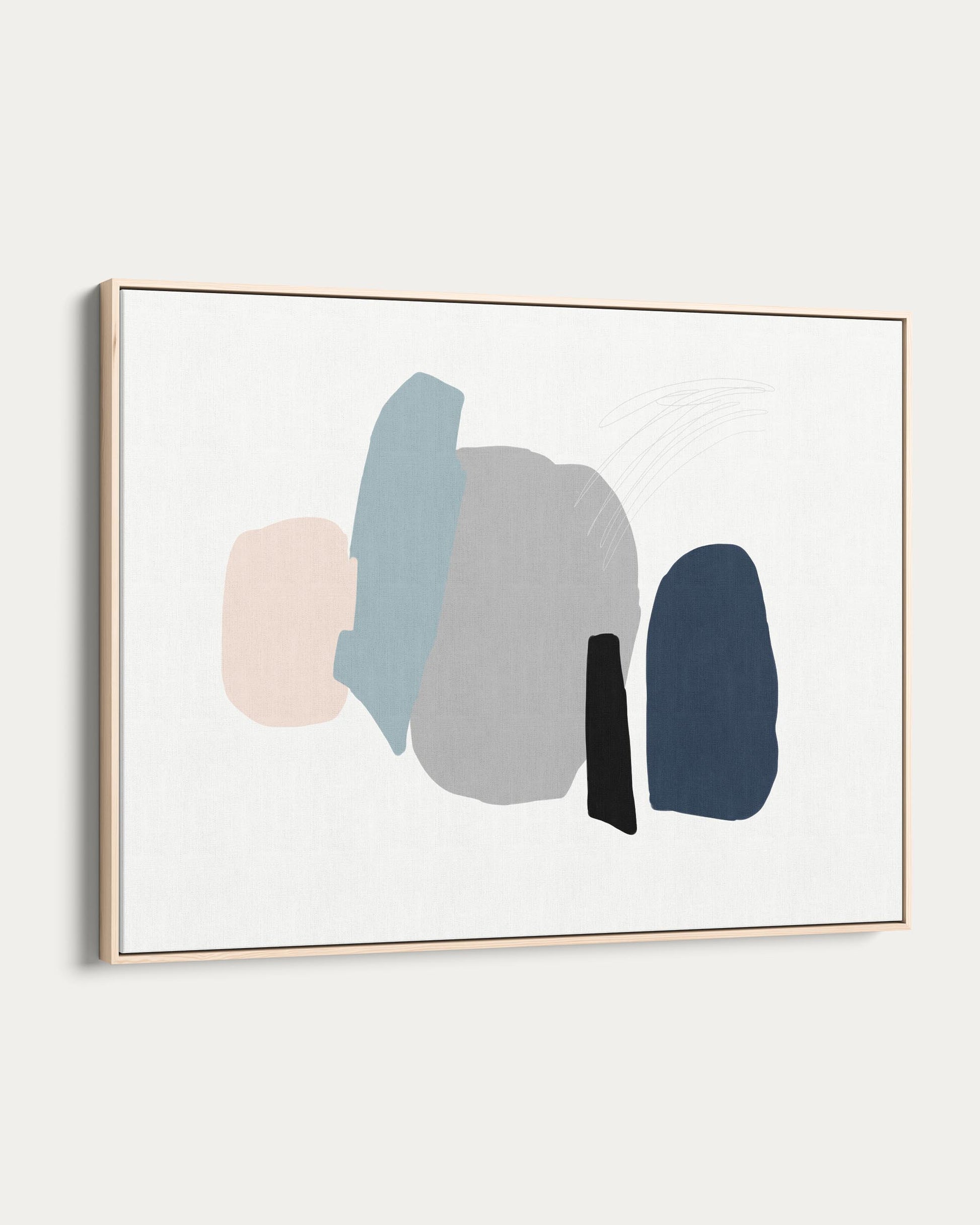 Framed abstract art with colorful shapes on a white wall