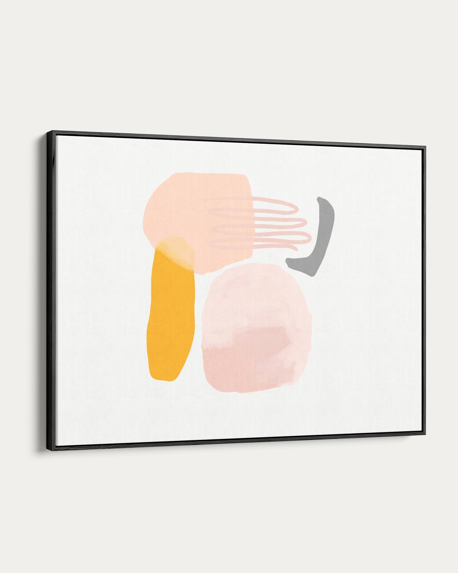 Framed abstract art with colorful shapes on a white wall