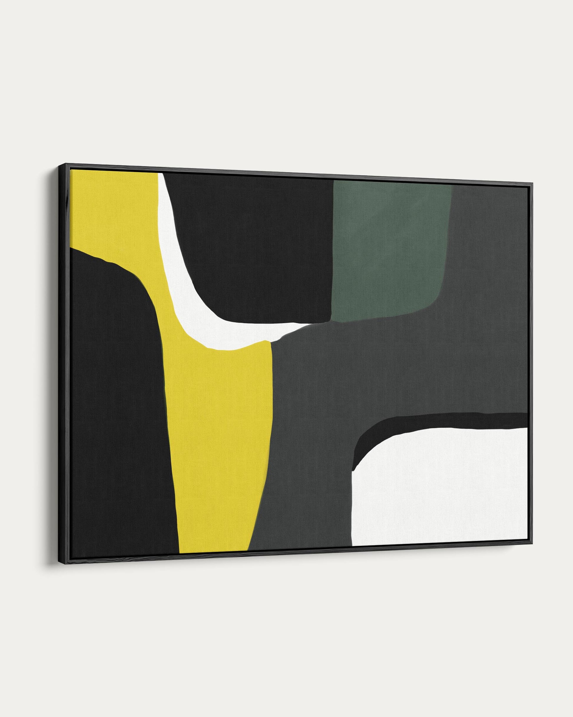 Abstract art piece with black, yellow, and white on a white wall