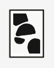 Framed abstract art with black shapes on a white background