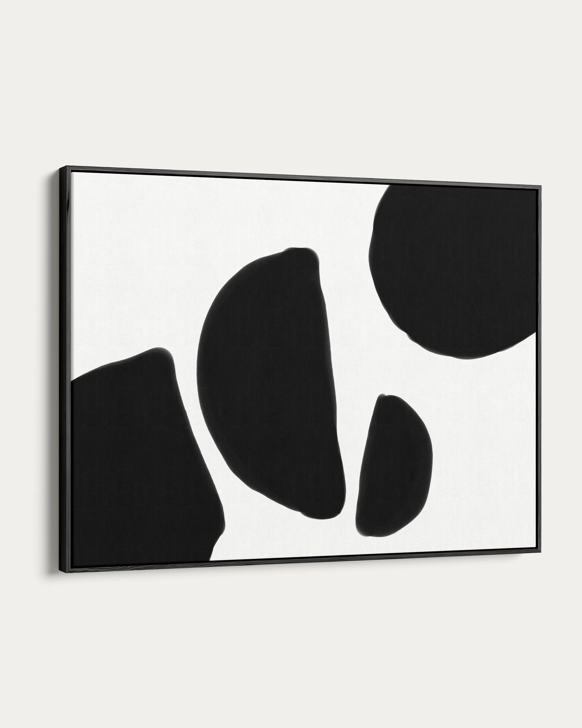 Framed abstract art with black shapes on a white background