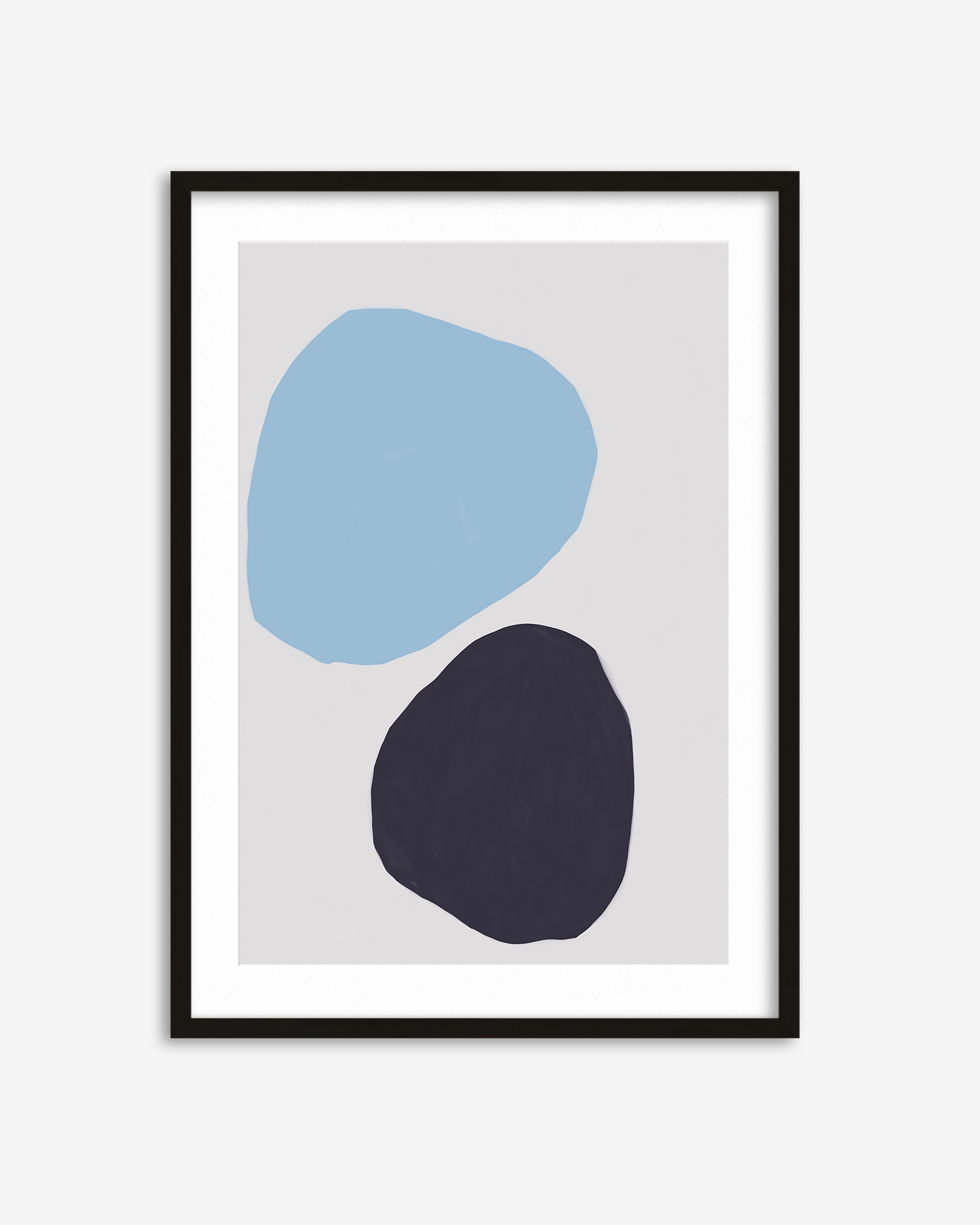 Framed abstract art print with blue and black shapes on a white background