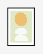 Framed abstract art print with a yellow circle and two white half-circles on a light green background