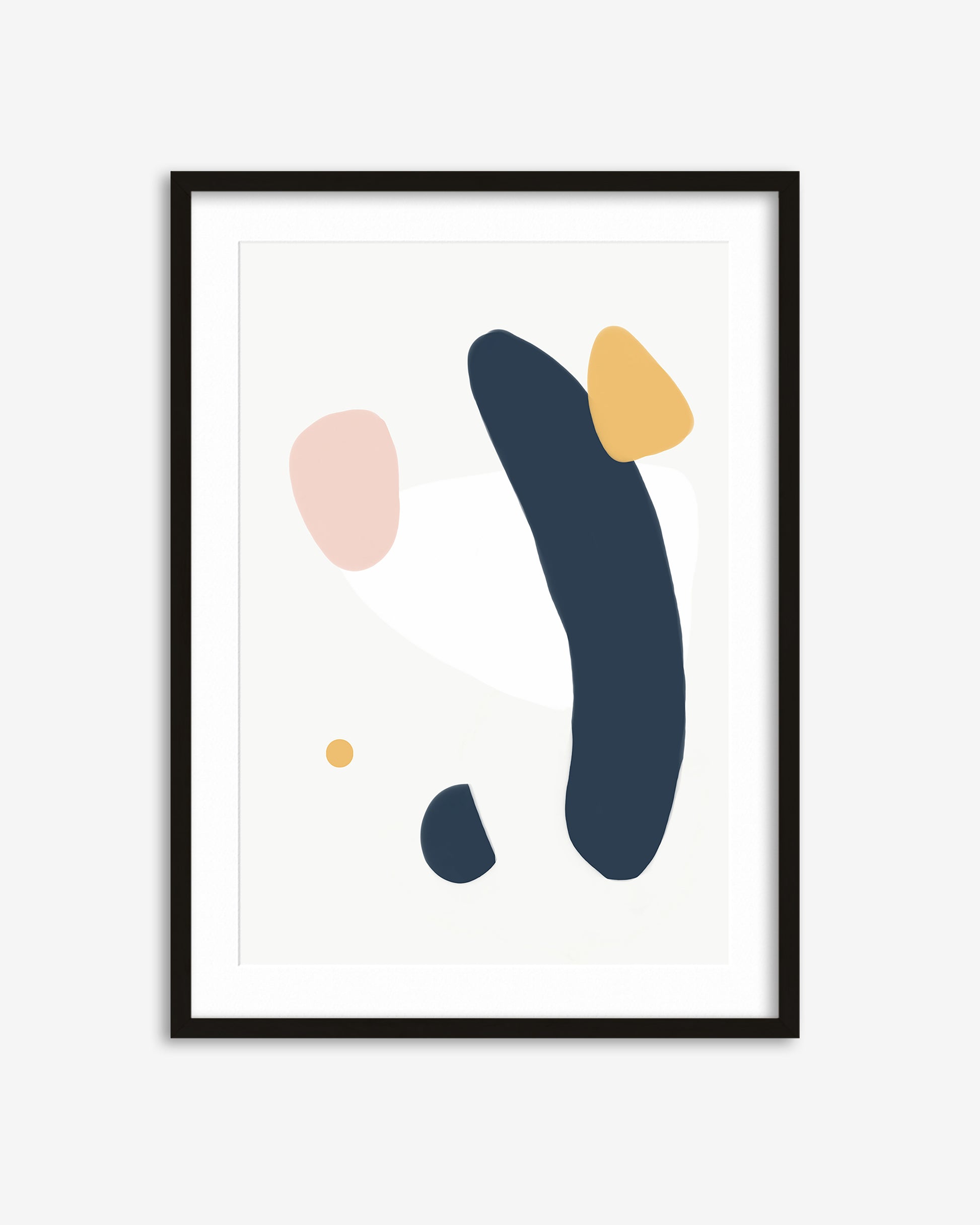 Framed abstract art print with colorful shapes on a white background