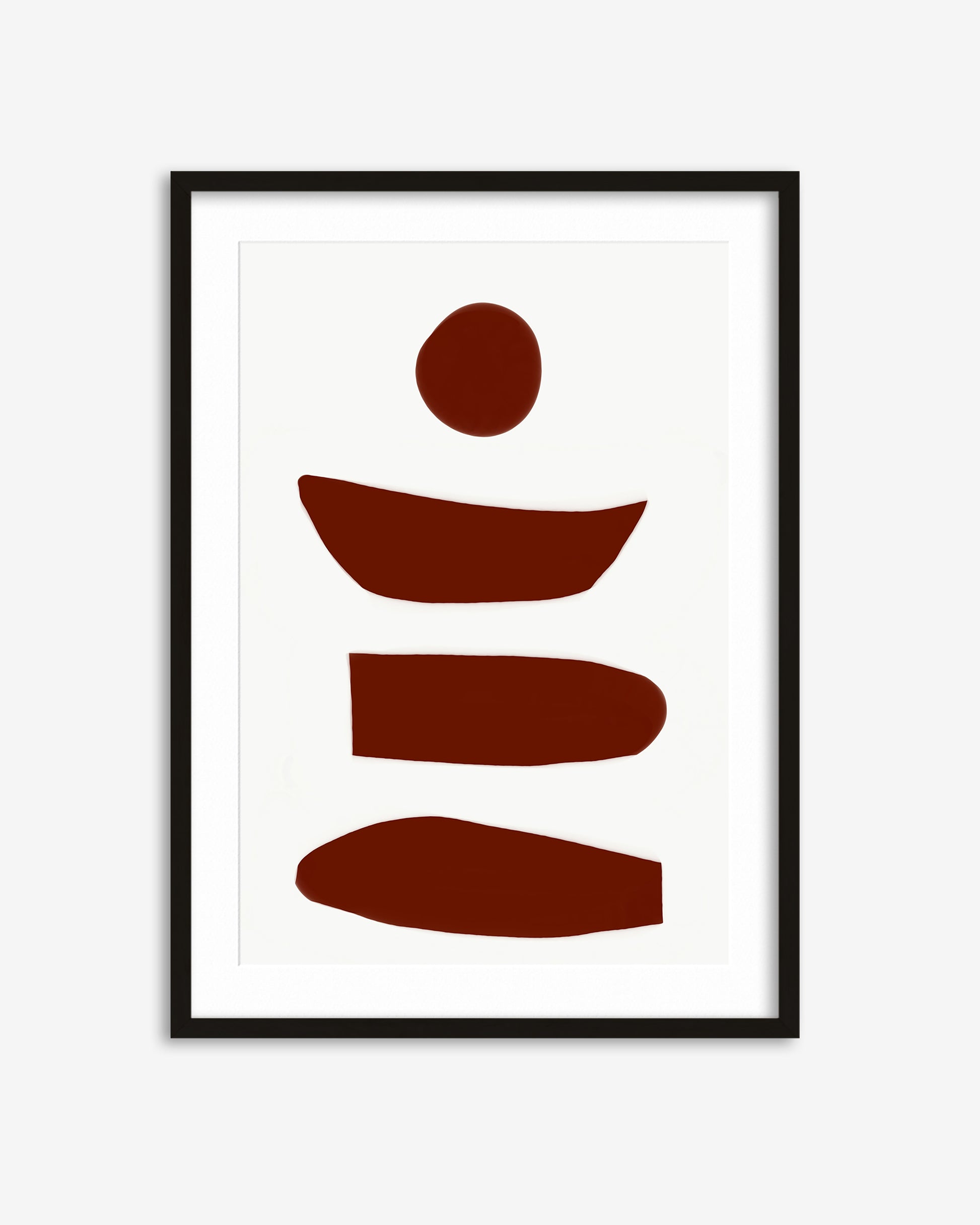 Framed abstract art print with brown shapes on a white background