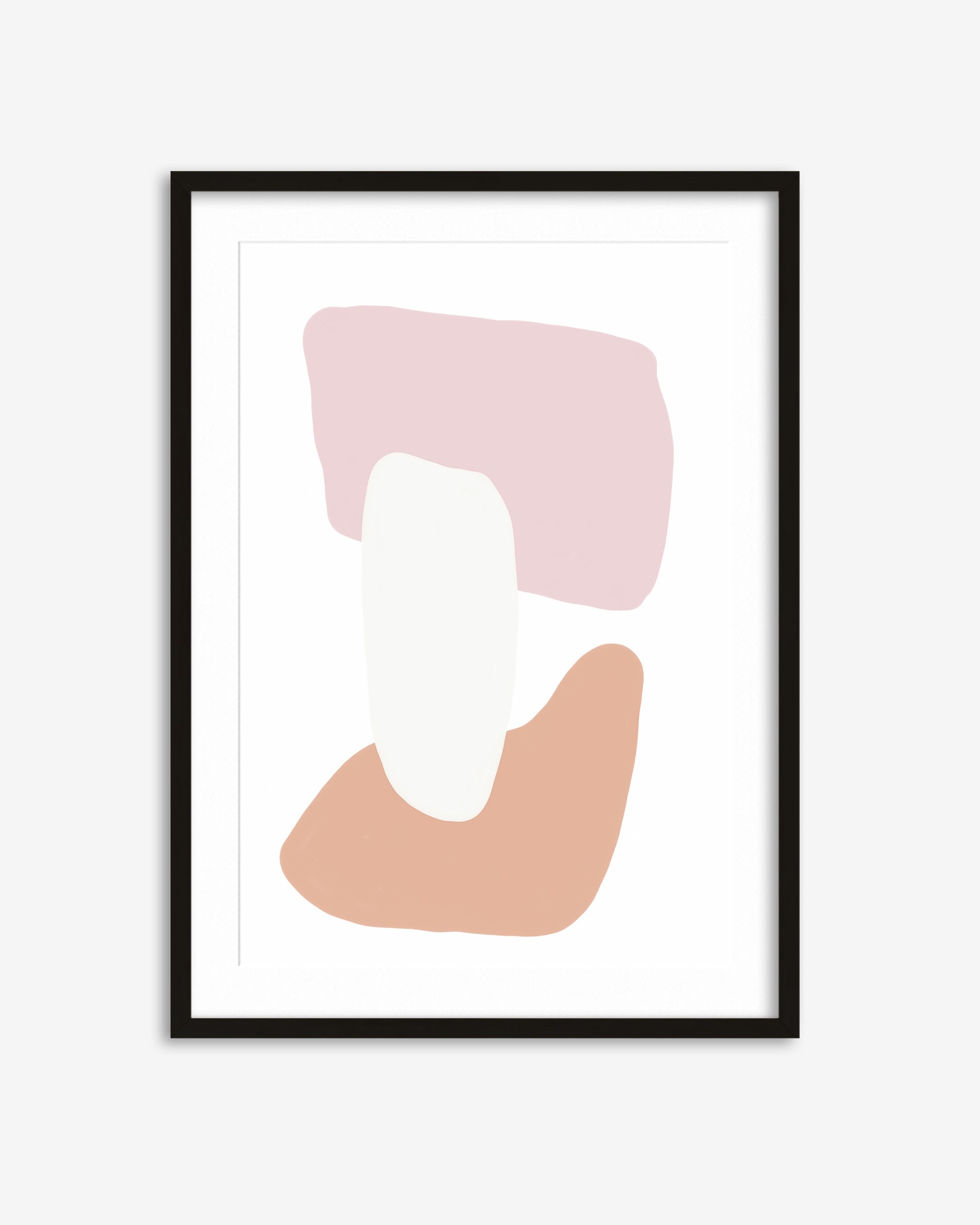 Framed abstract art print with pink and beige shapes on a white background