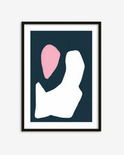 Framed abstract art print with pink and white shapes on a dark blue background