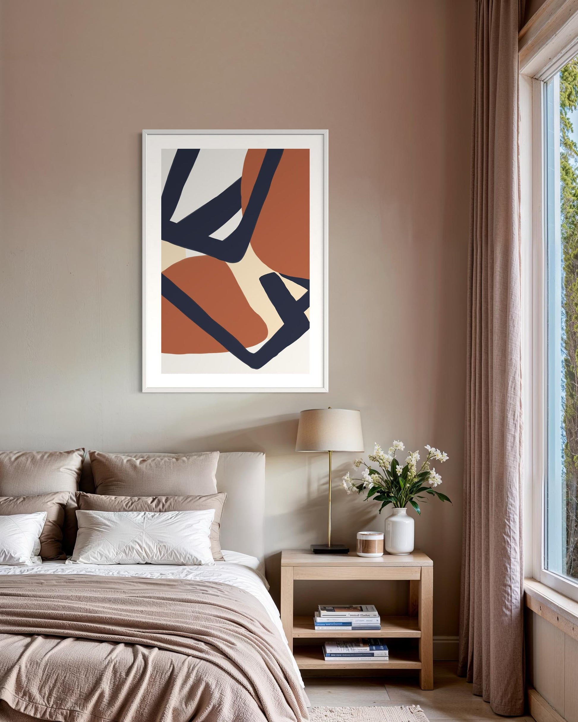 framed abstract artwork above bed in bedroom