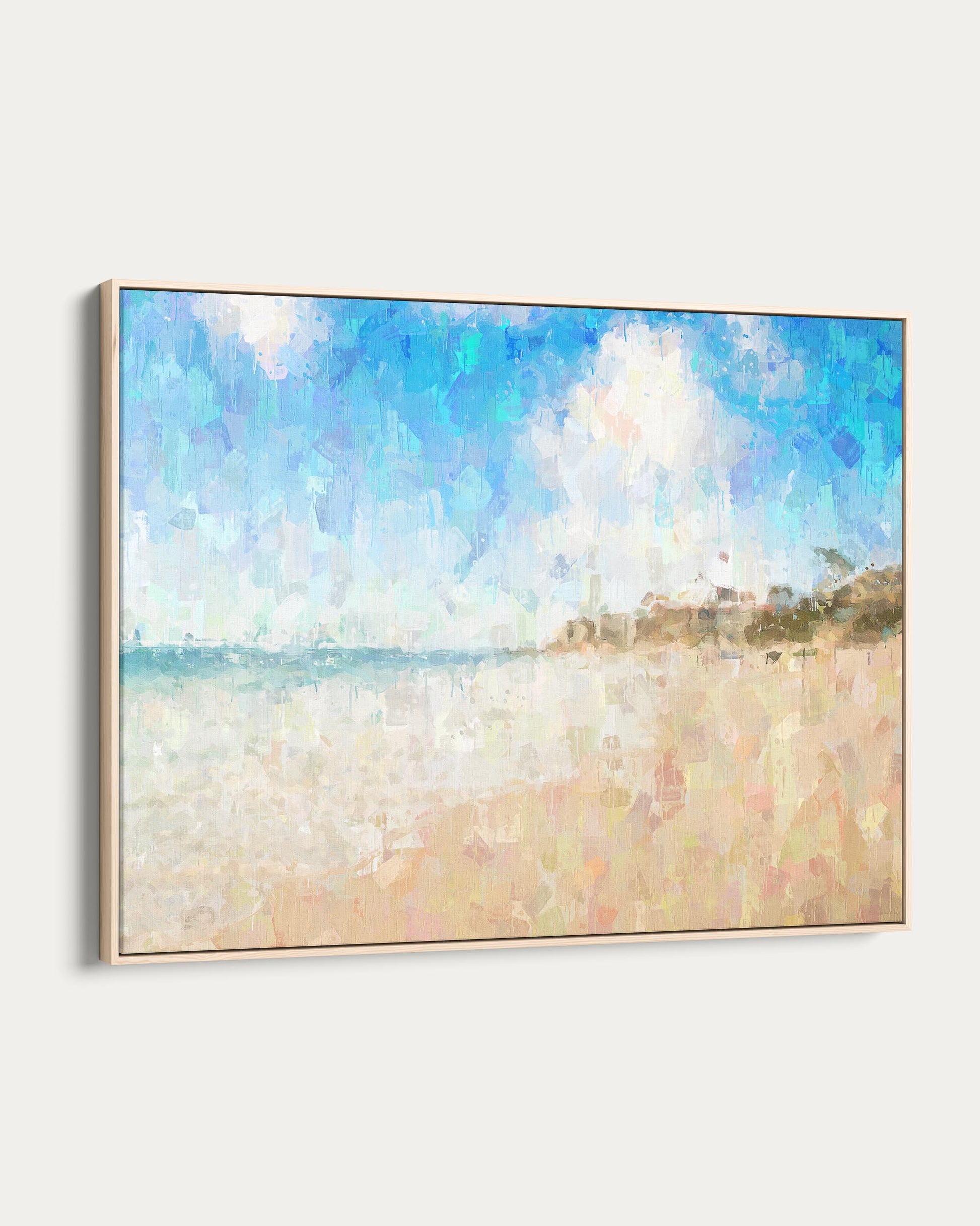 Framed artwork of a beach scene with a blue sky and white clouds.