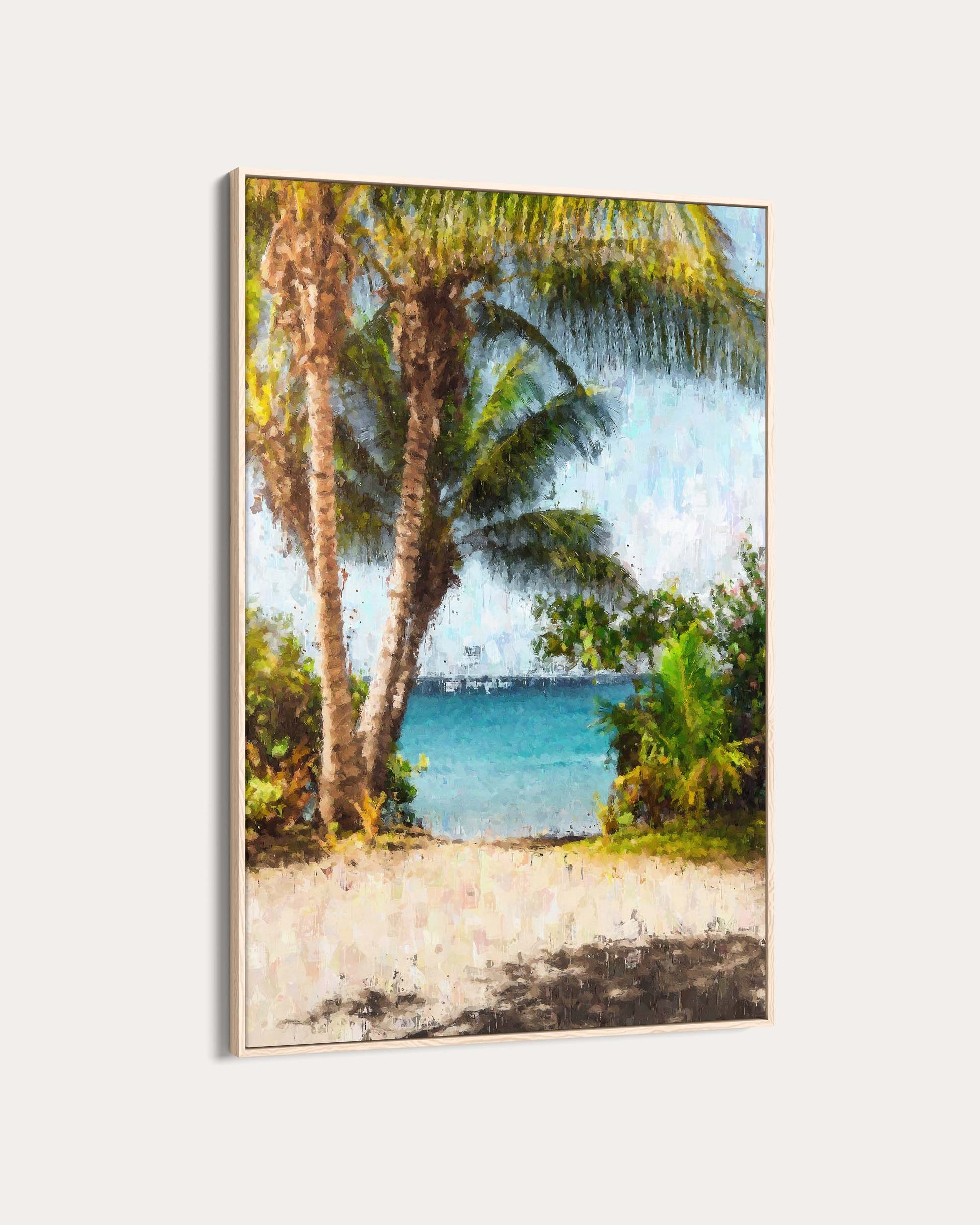 Framed artwork of a tropical beach scene with palm trees and clear blue water.