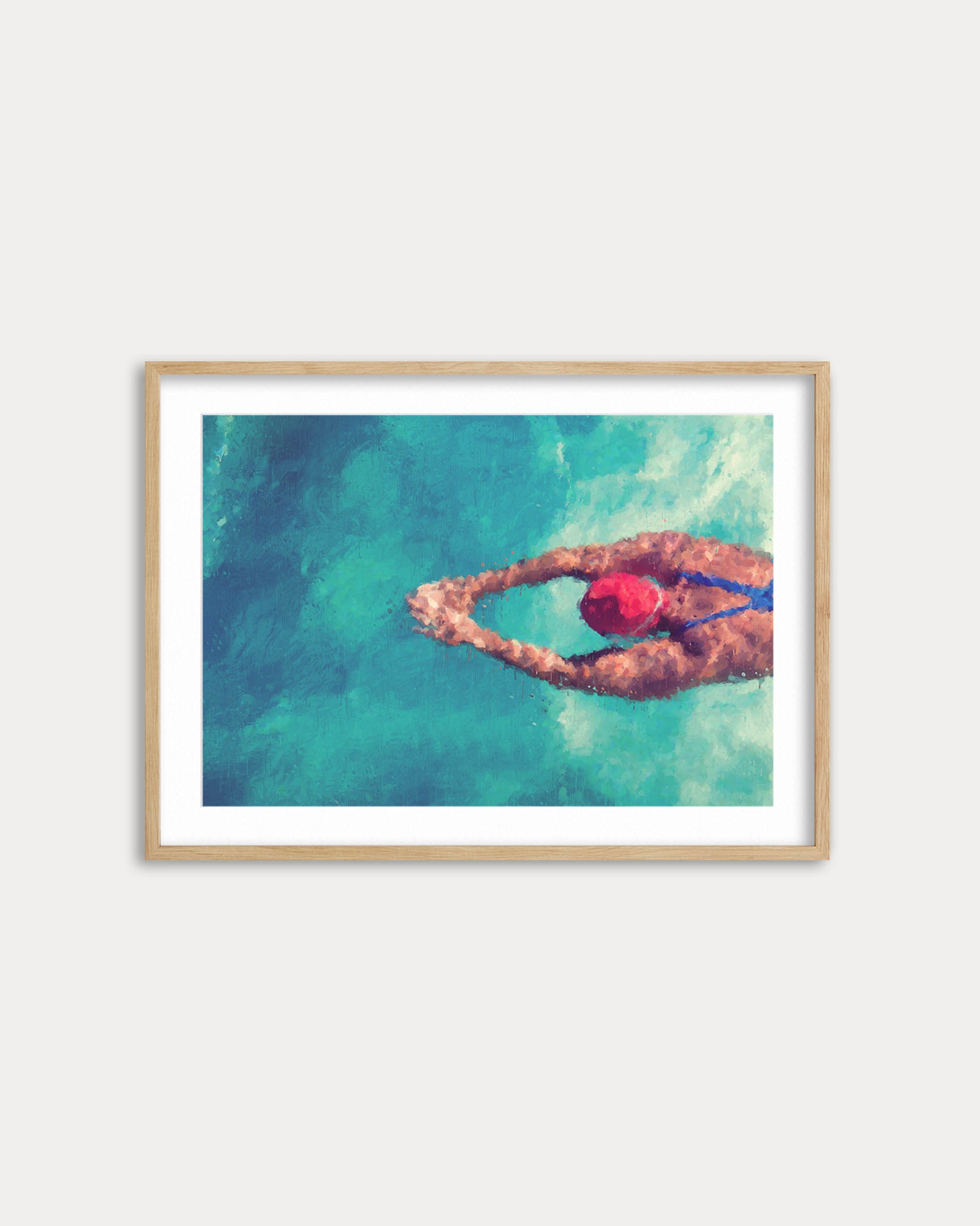 Framed artwork of a swimmer in a pool with a red swim cap.