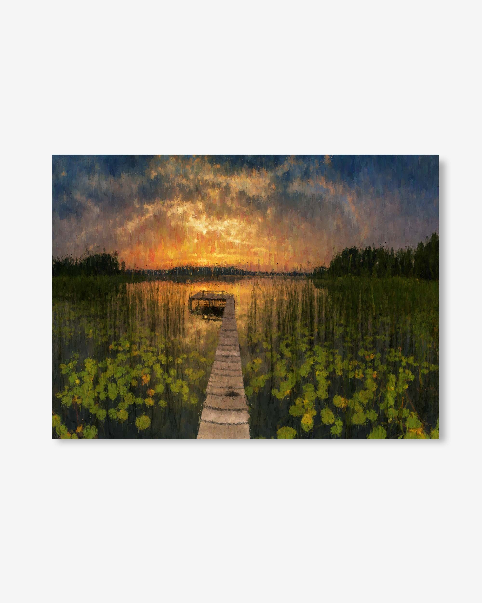 Wooden dock extending into a lake with a sunset sky