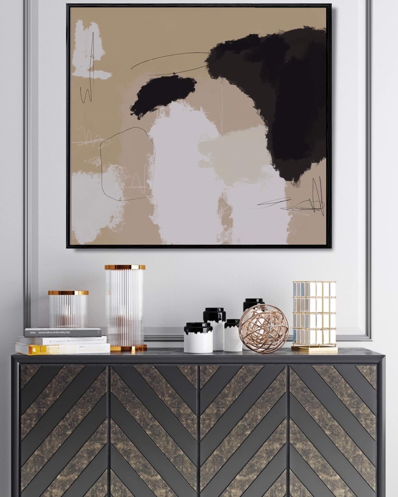 Abstract art piece on a wall above a decorative console table with various items.