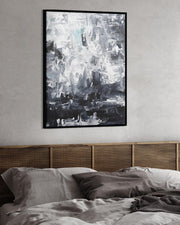 Abstract art print on a wall above a bed