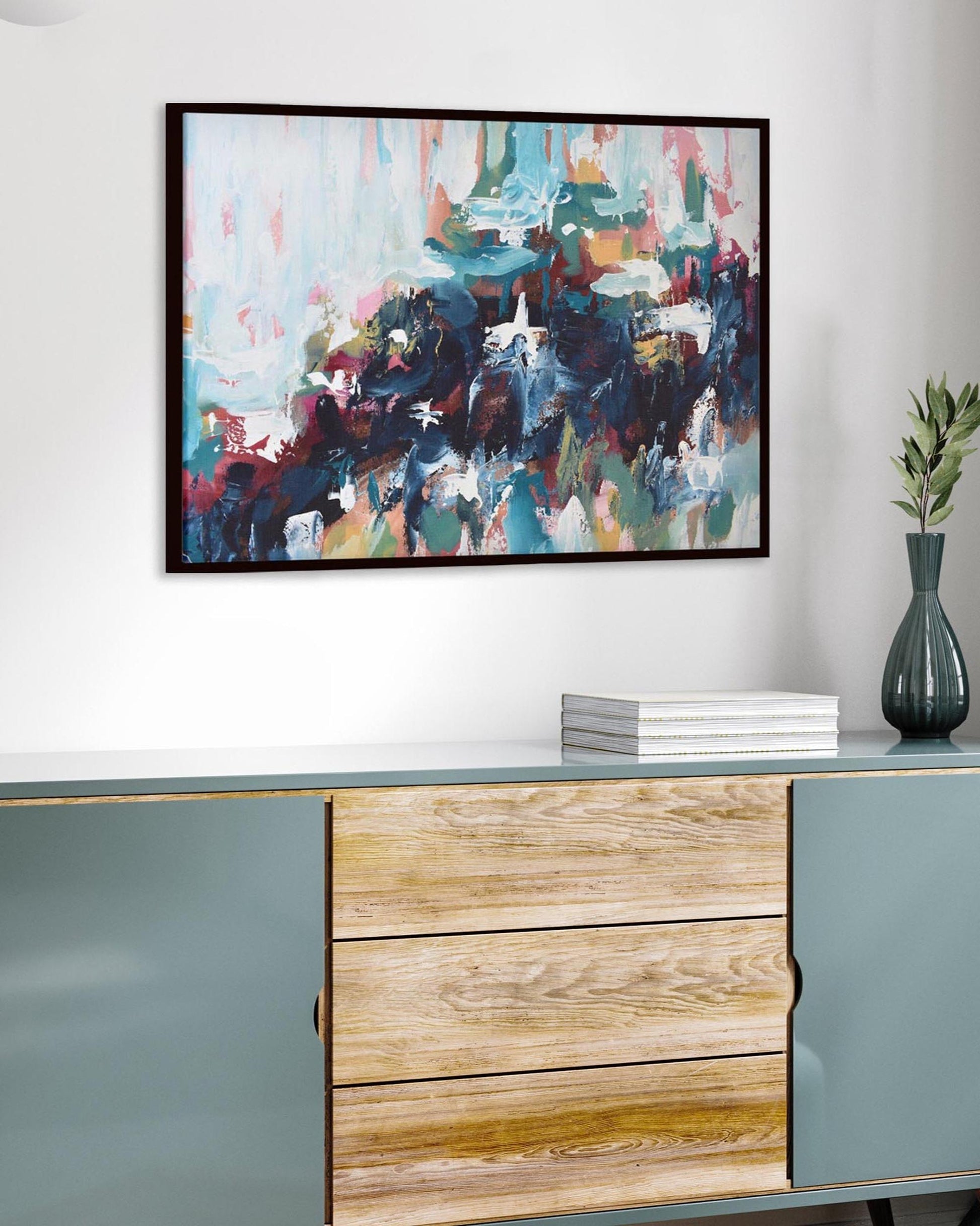 Modern interior with a sideboard, abstract painting, and vase.