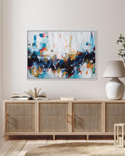 Modern living room with a wooden sideboard, abstract painting, and decorative items.