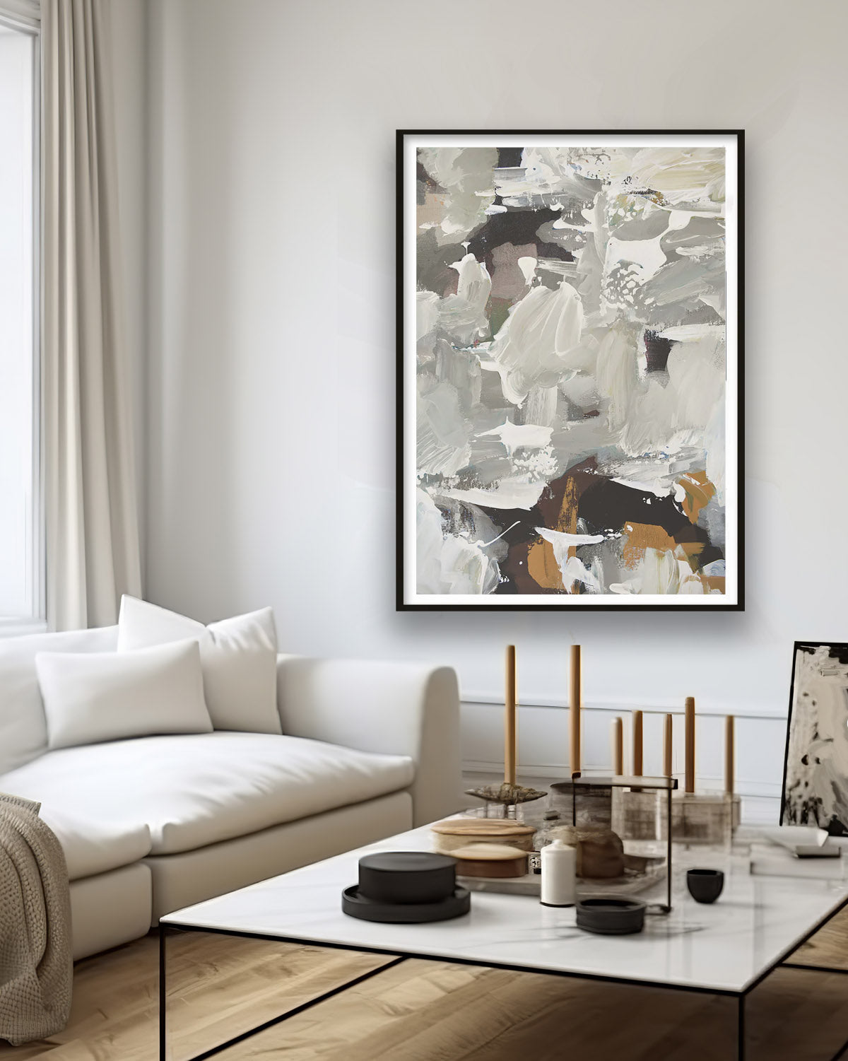 modern neutral abstract wall art print framed in scandinavian beige living room with modern marble coffee table accessorised with candles, black and brown sustainable accents
