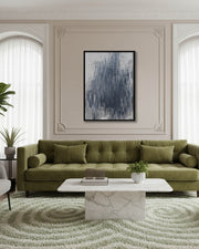 modern olive green large 5 seater sofa with white marble table and large grey abstract wall art on neutral wall