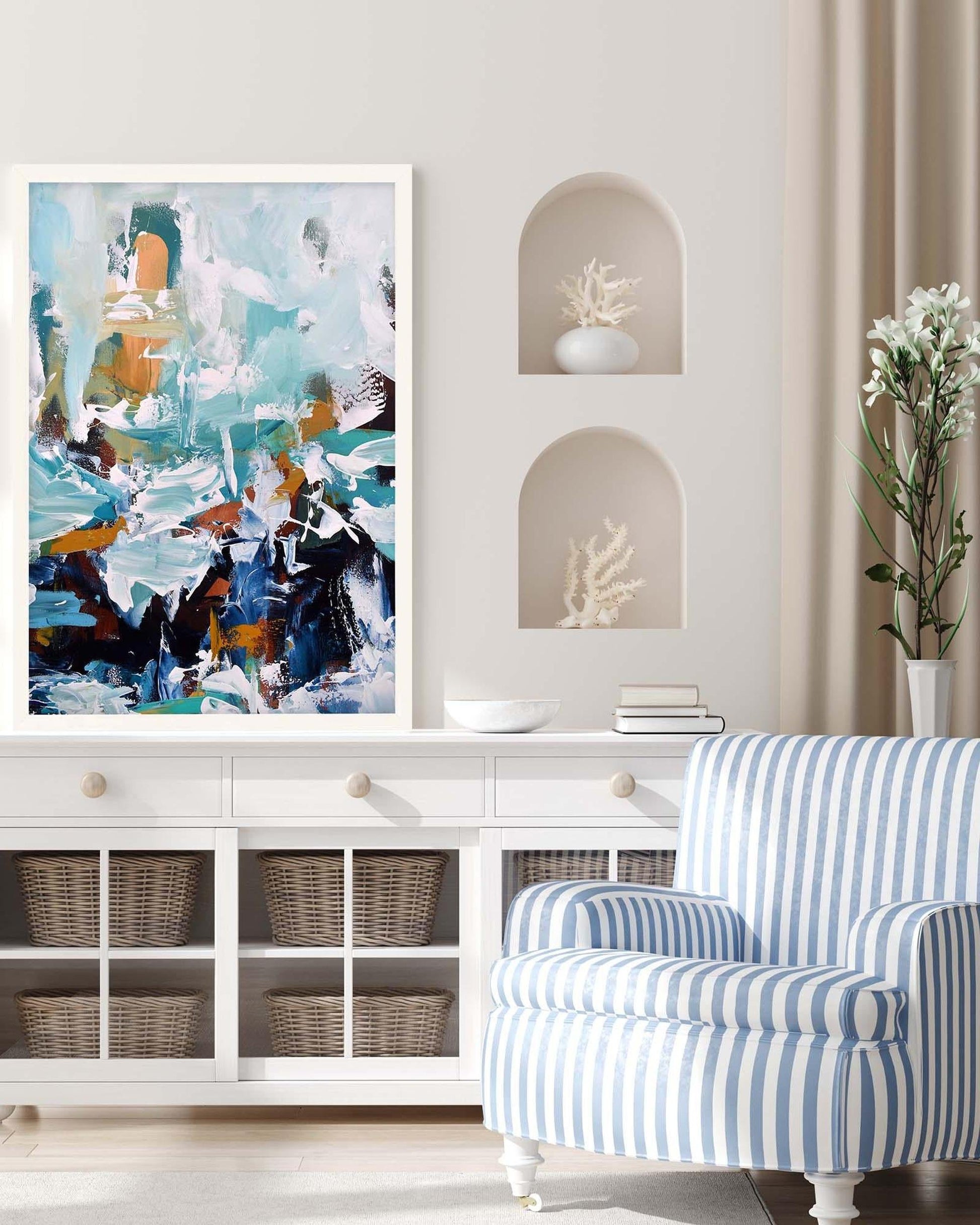 Modern living room with abstract art, striped armchair, and decorative shelves.