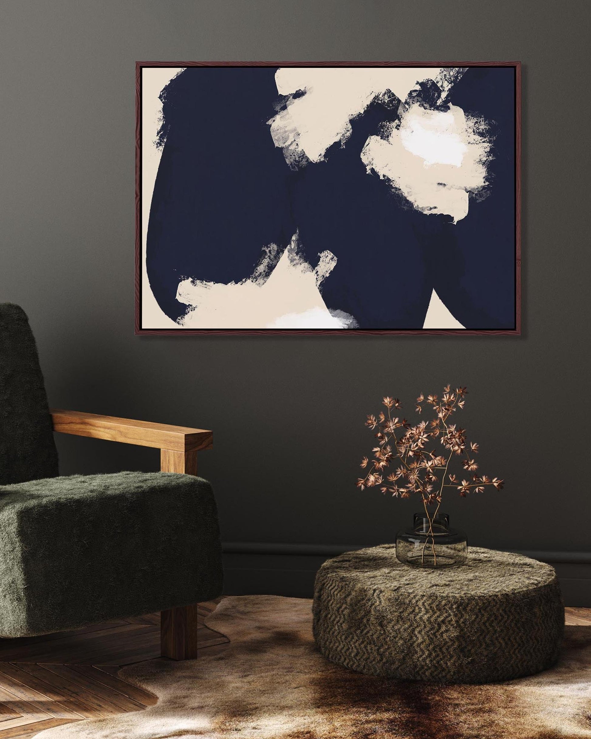 Modern interior with a green armchair, abstract painting, and small table with a plant.