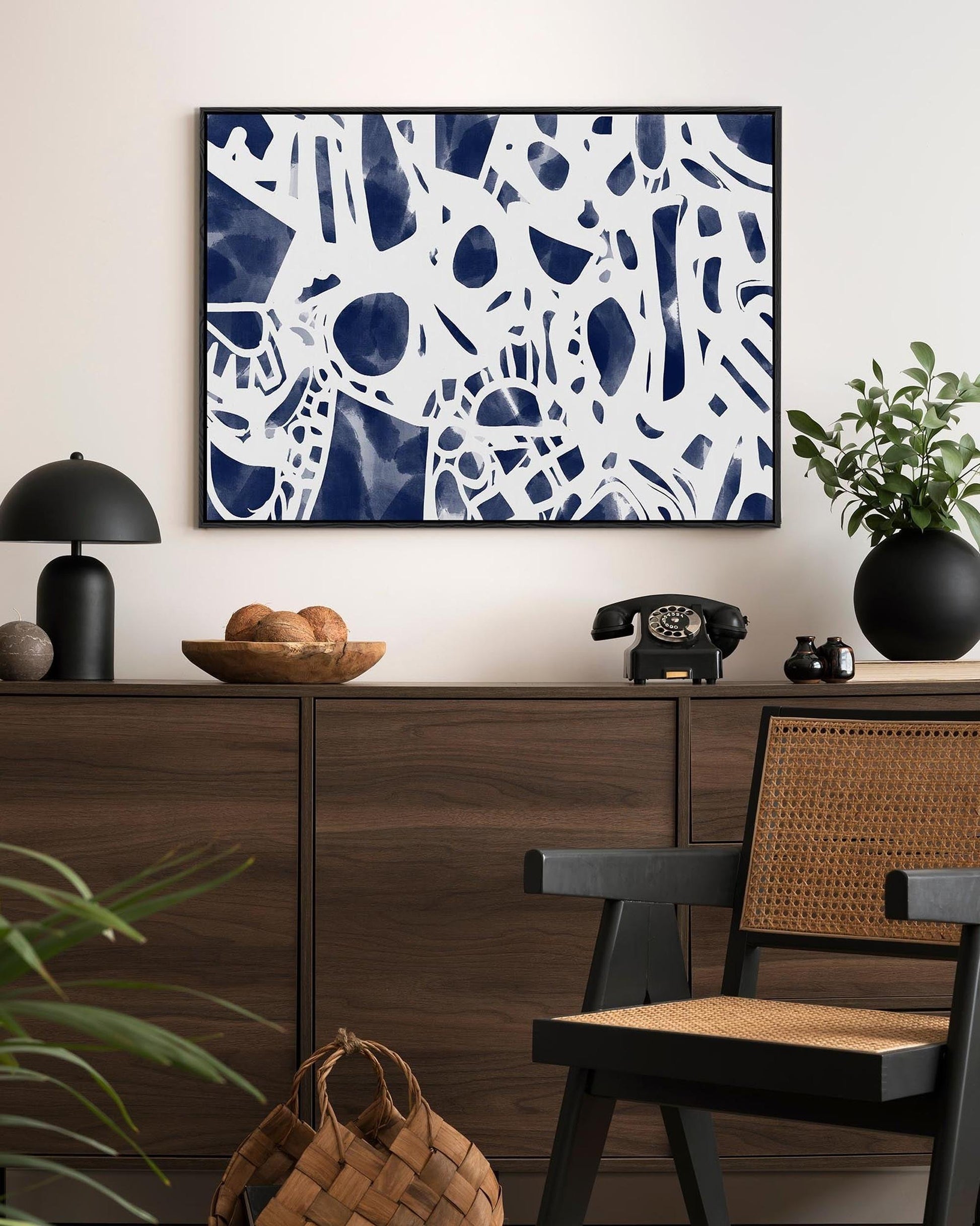 Modern interior with abstract art, furniture, and decor items.
