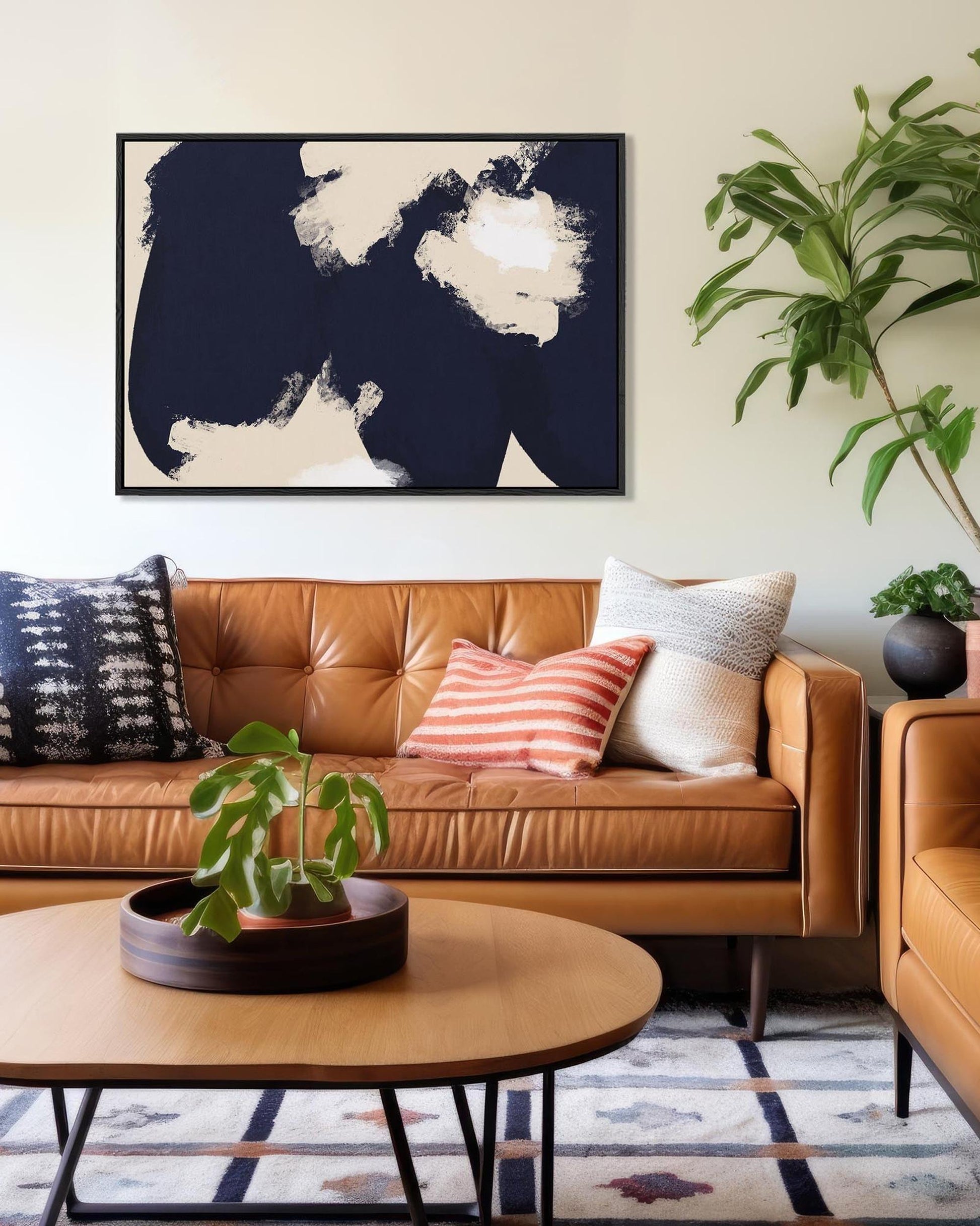 Living room with brown leather sofa, decorative pillows, and a world map art piece.