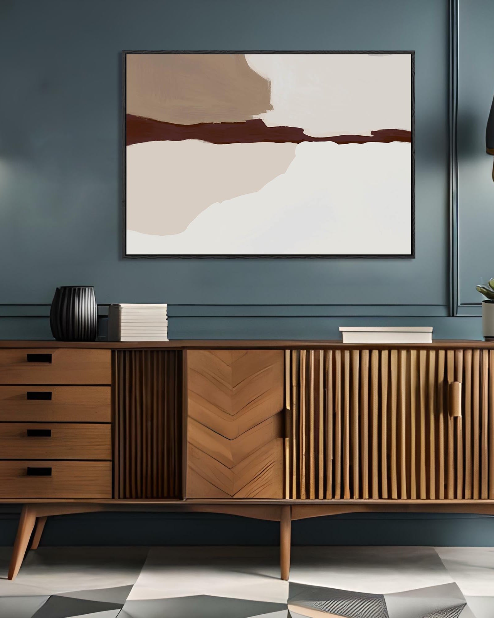 Wooden sideboard with abstract art on a blue wall