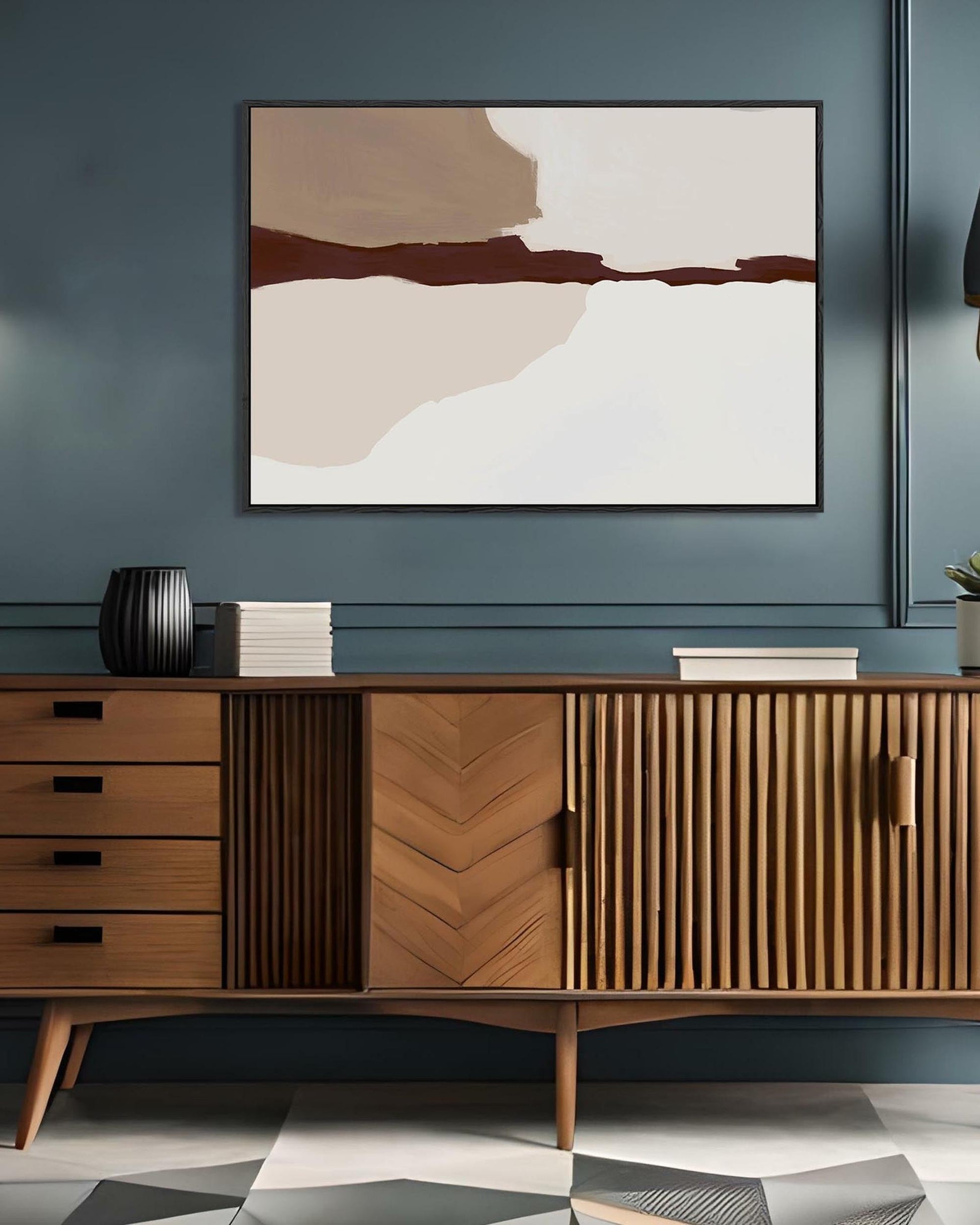 Wooden sideboard with abstract art on a blue wall
