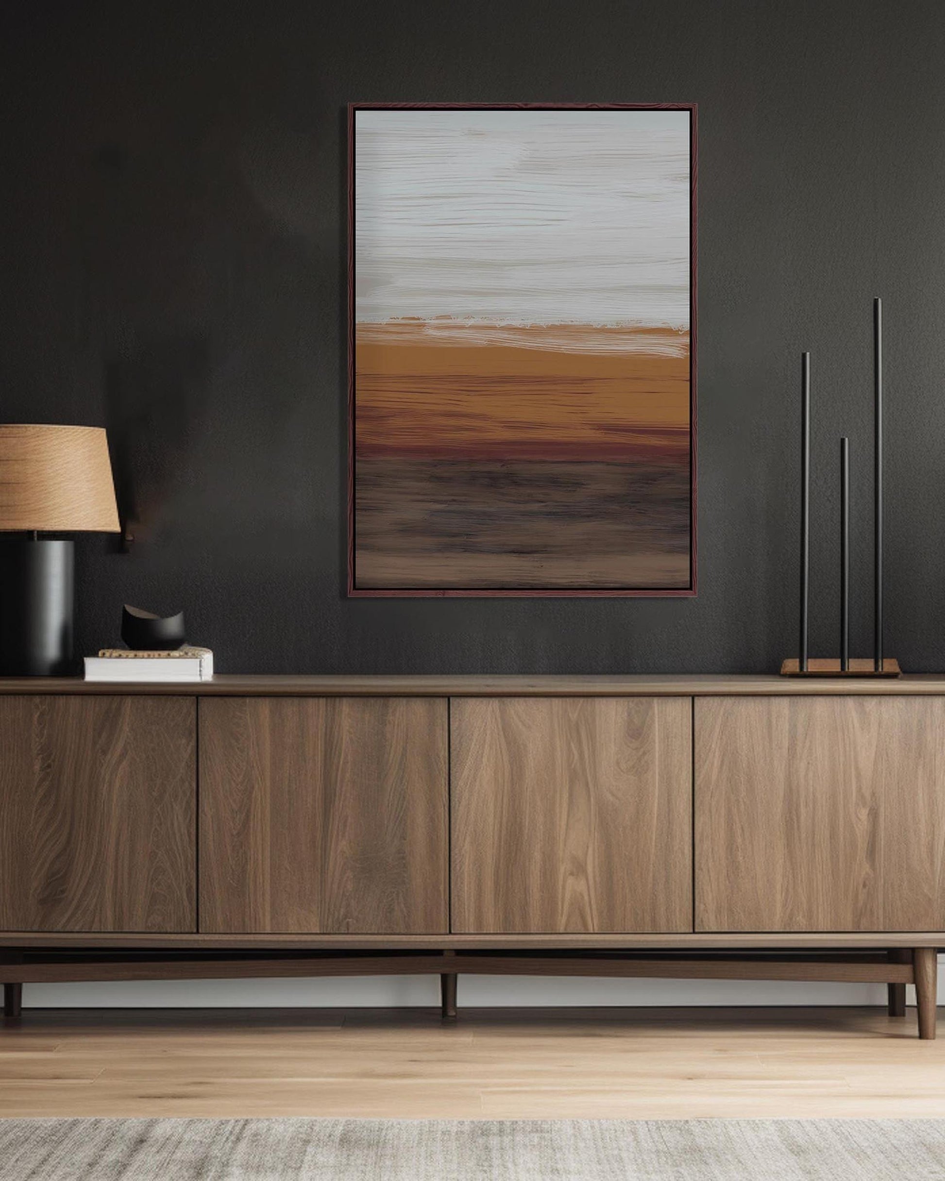 Wooden sideboard against a dark wall with abstract art above it