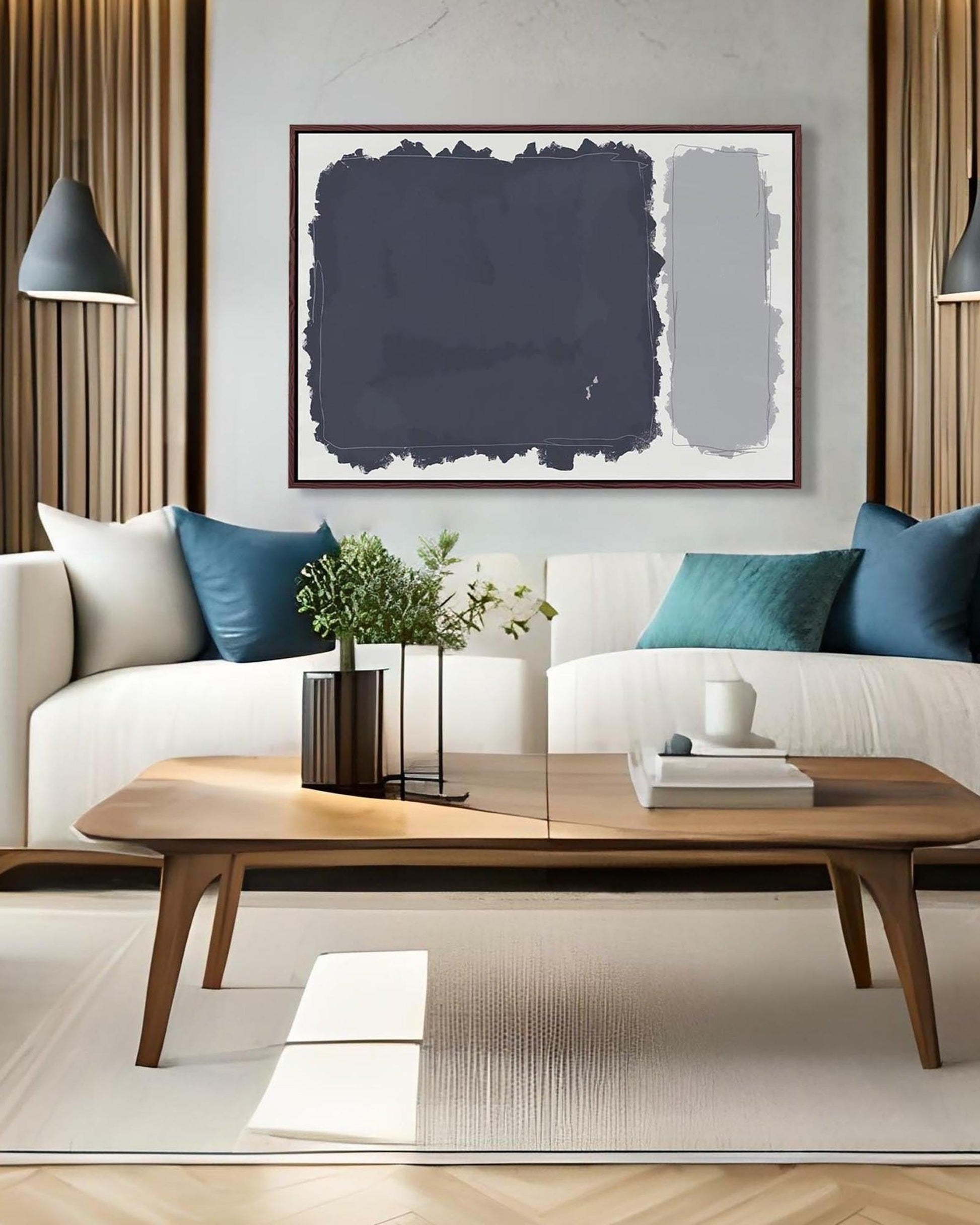 Modern living room with a white sofa, wooden coffee table, and abstract art on the wall.