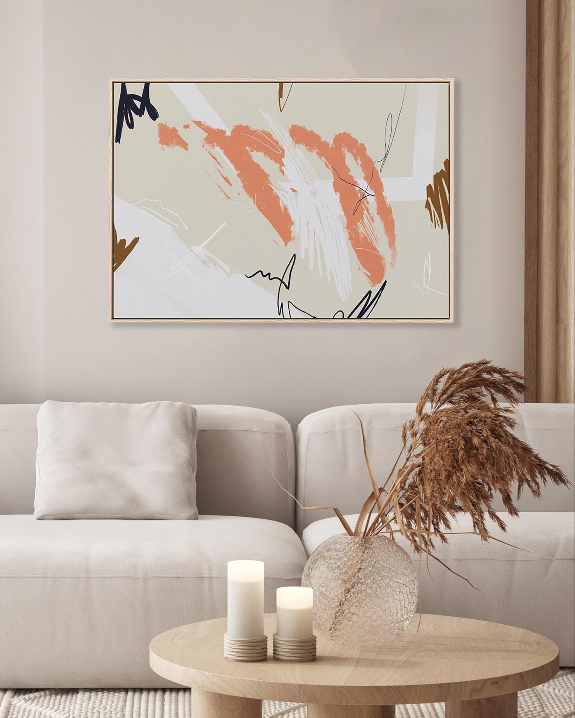 Living room with a beige sofa, abstract painting, and decorative items.