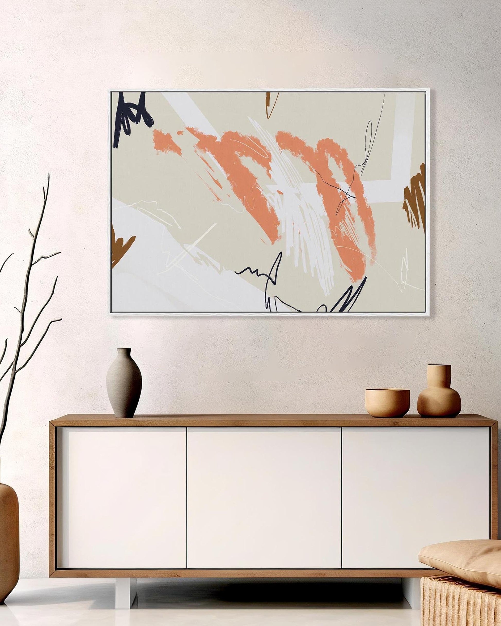 Modern living room with abstract art, vases, and a console table.