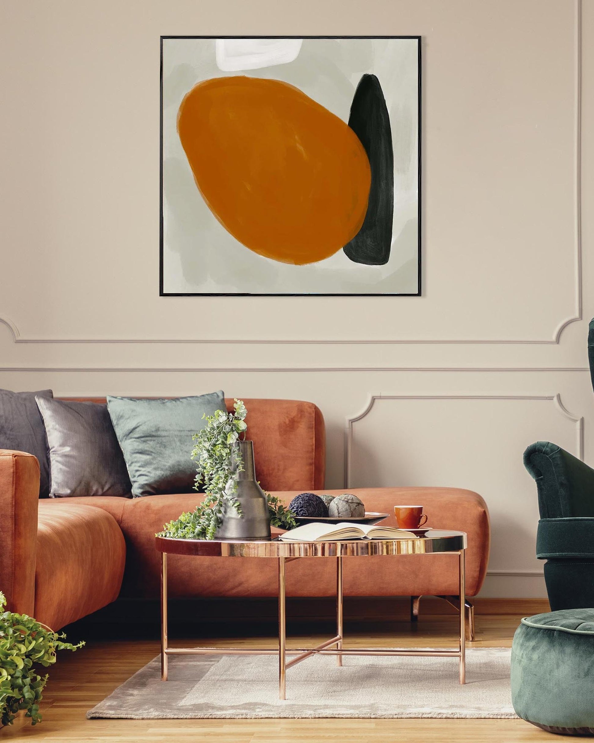 Modern living room with a brown sofa, abstract art, and decorative items.