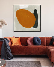 Living room with a brown sectional sofa, colorful cushions, and abstract art on the wall.