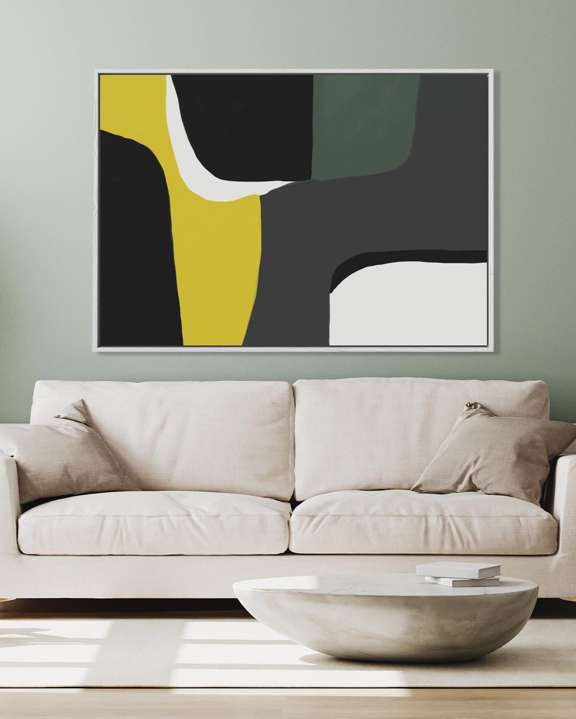 Beige sofa in a living room with a modern abstract painting on the wall.