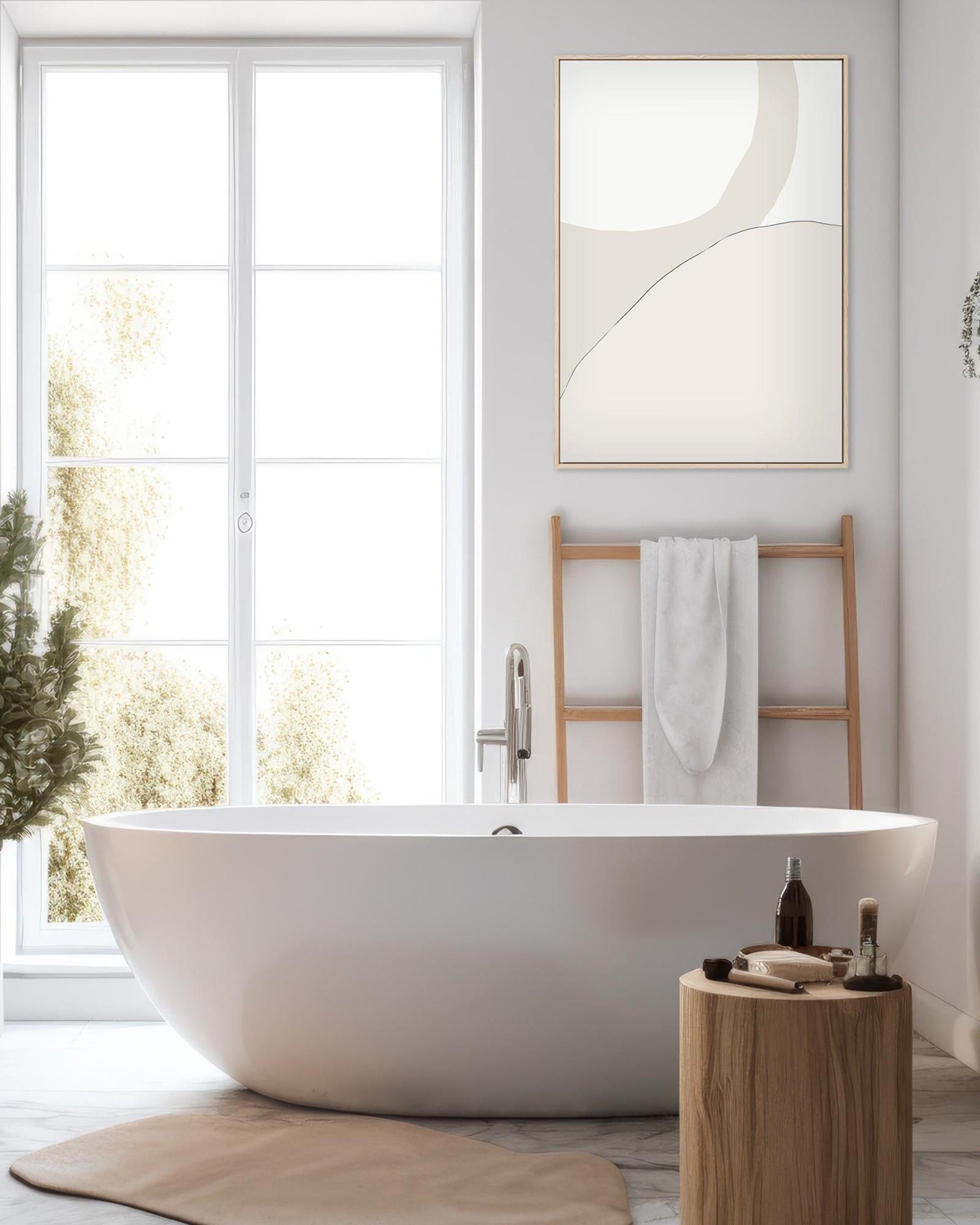 Modern bathroom with a freestanding bathtub, wooden stool, and abstract art on the wall.