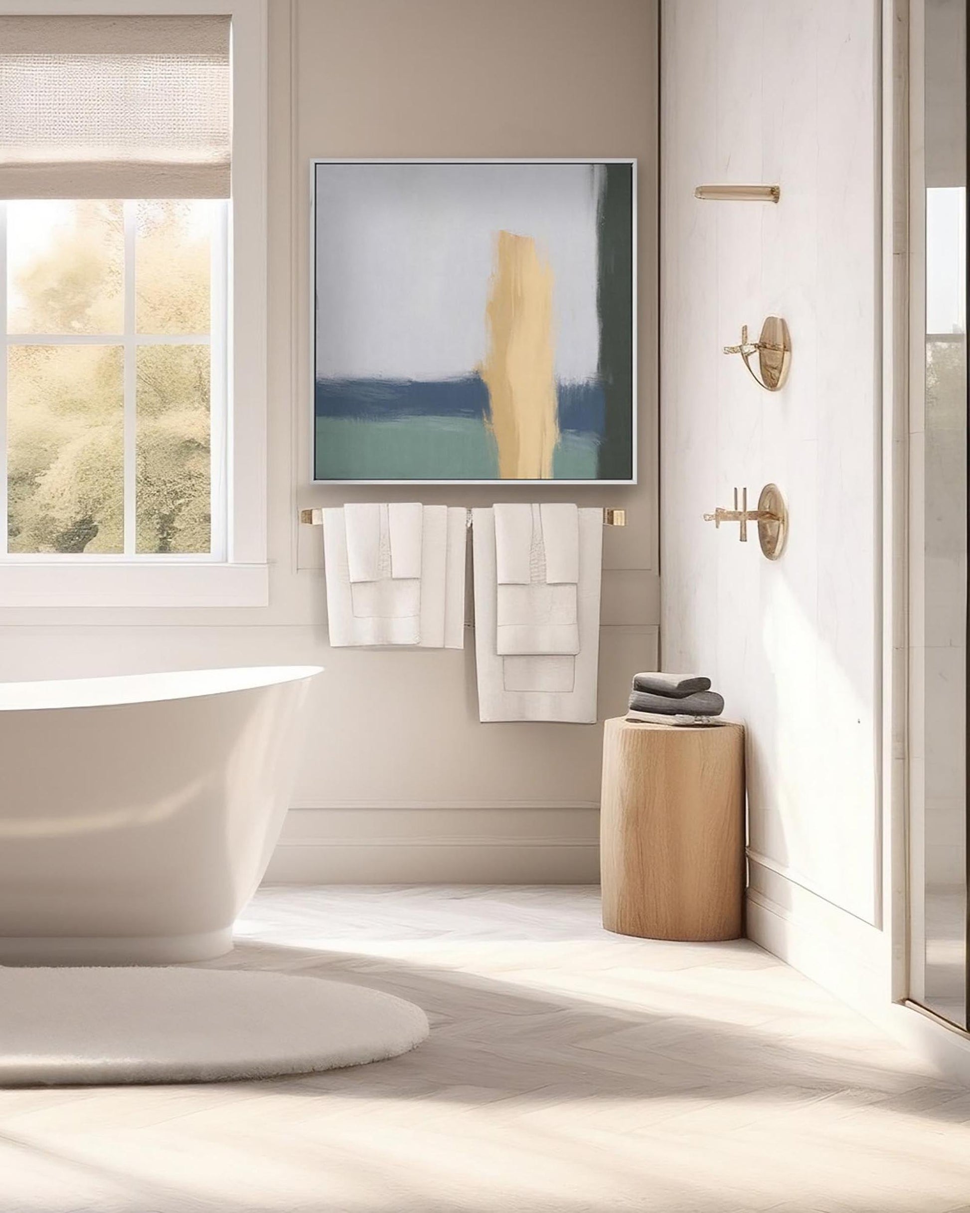 Modern bathroom interior with a bathtub, towel rack, and abstract art on the wall.